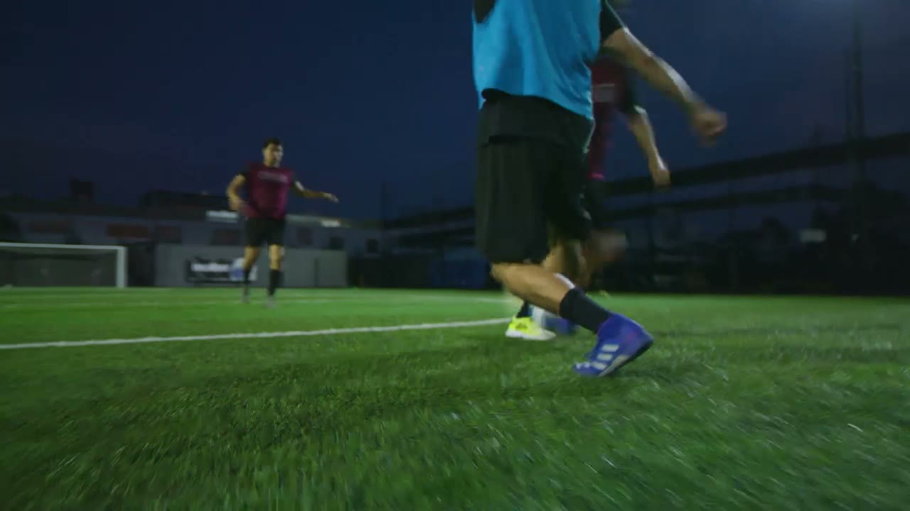 A player dribbling at dusk